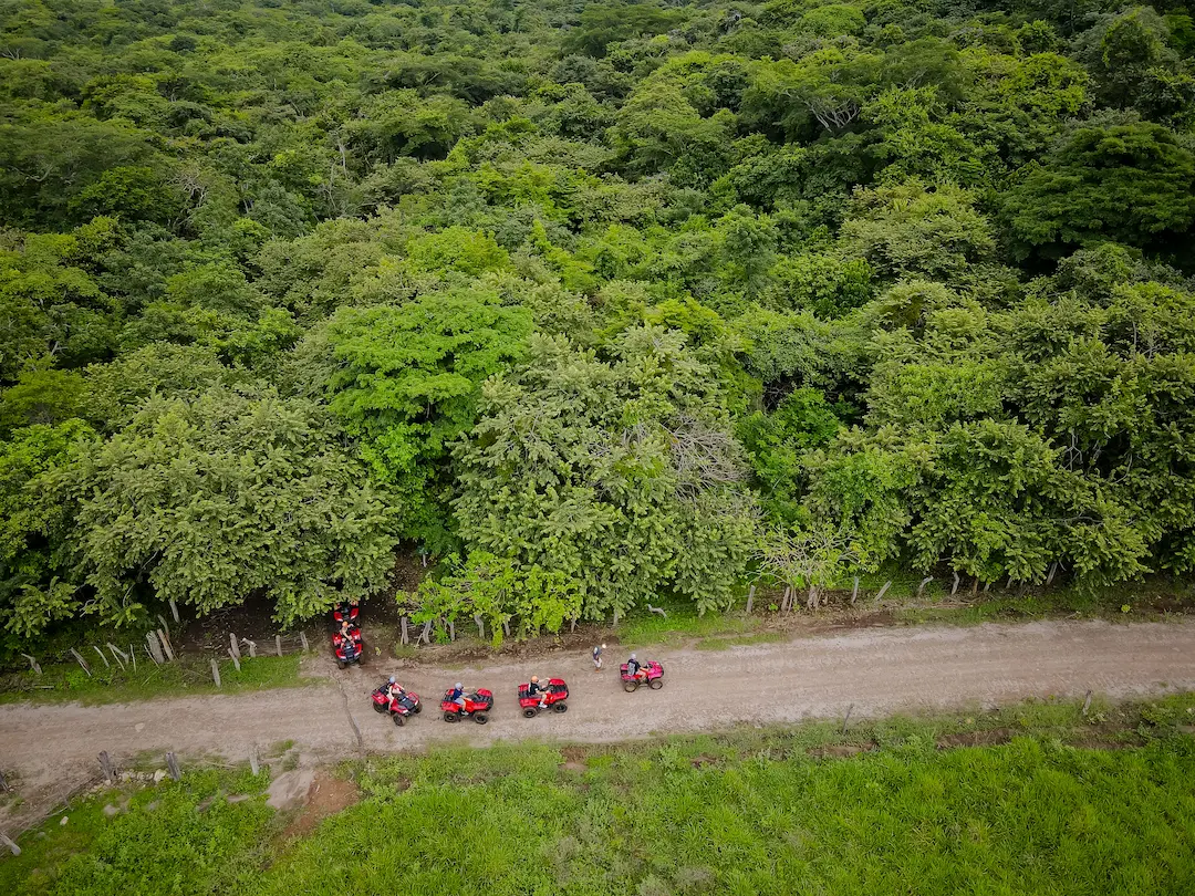 Private ATV group navigating rugged mountain terrain
