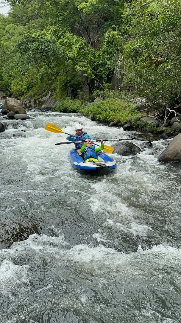 Children wearing properly fitted life jackets during a family water activity in Costa Rica