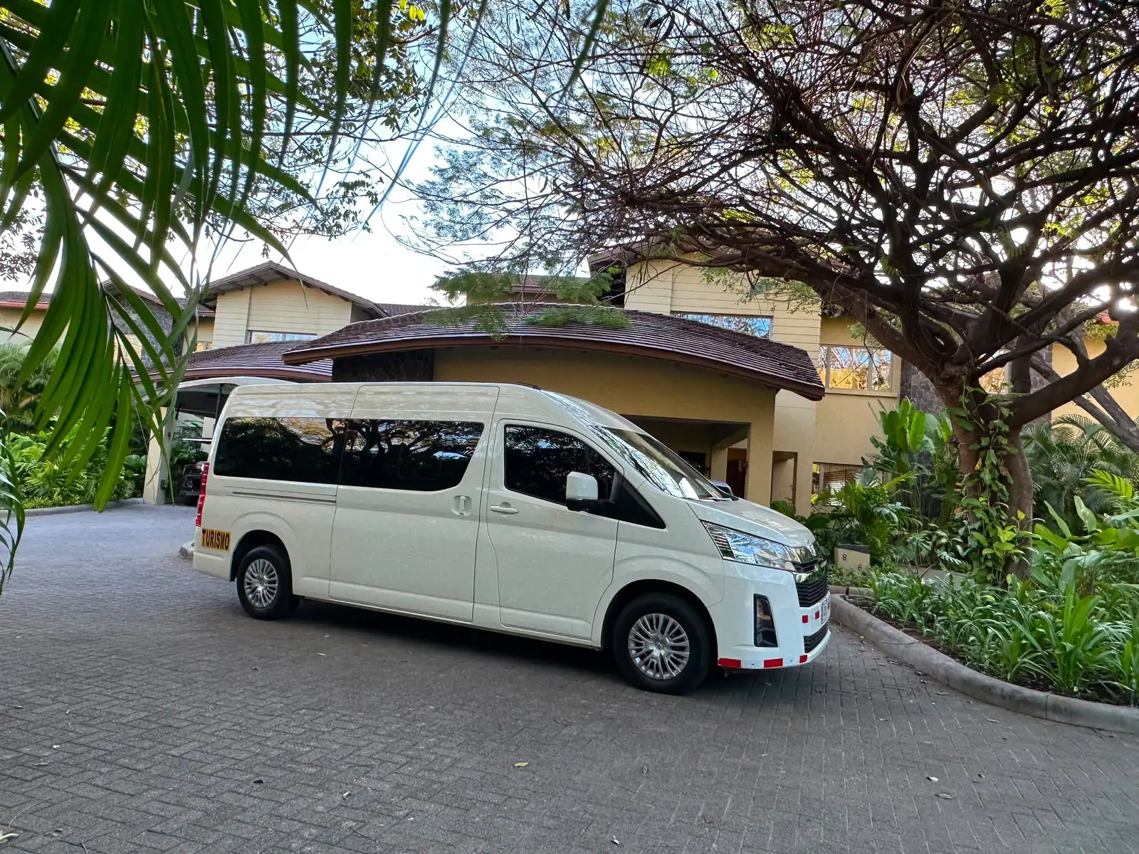 Private tourism van parked at a tropical property in Papagayo, Costa Rica