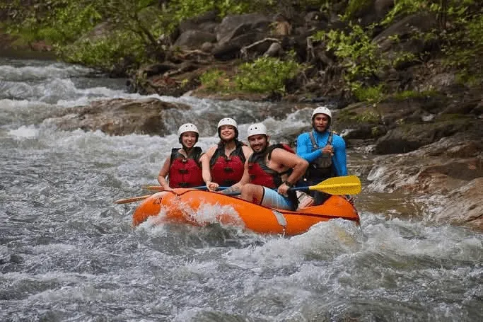Rafters celebrating after Class III-IV rapids, Tenorio River