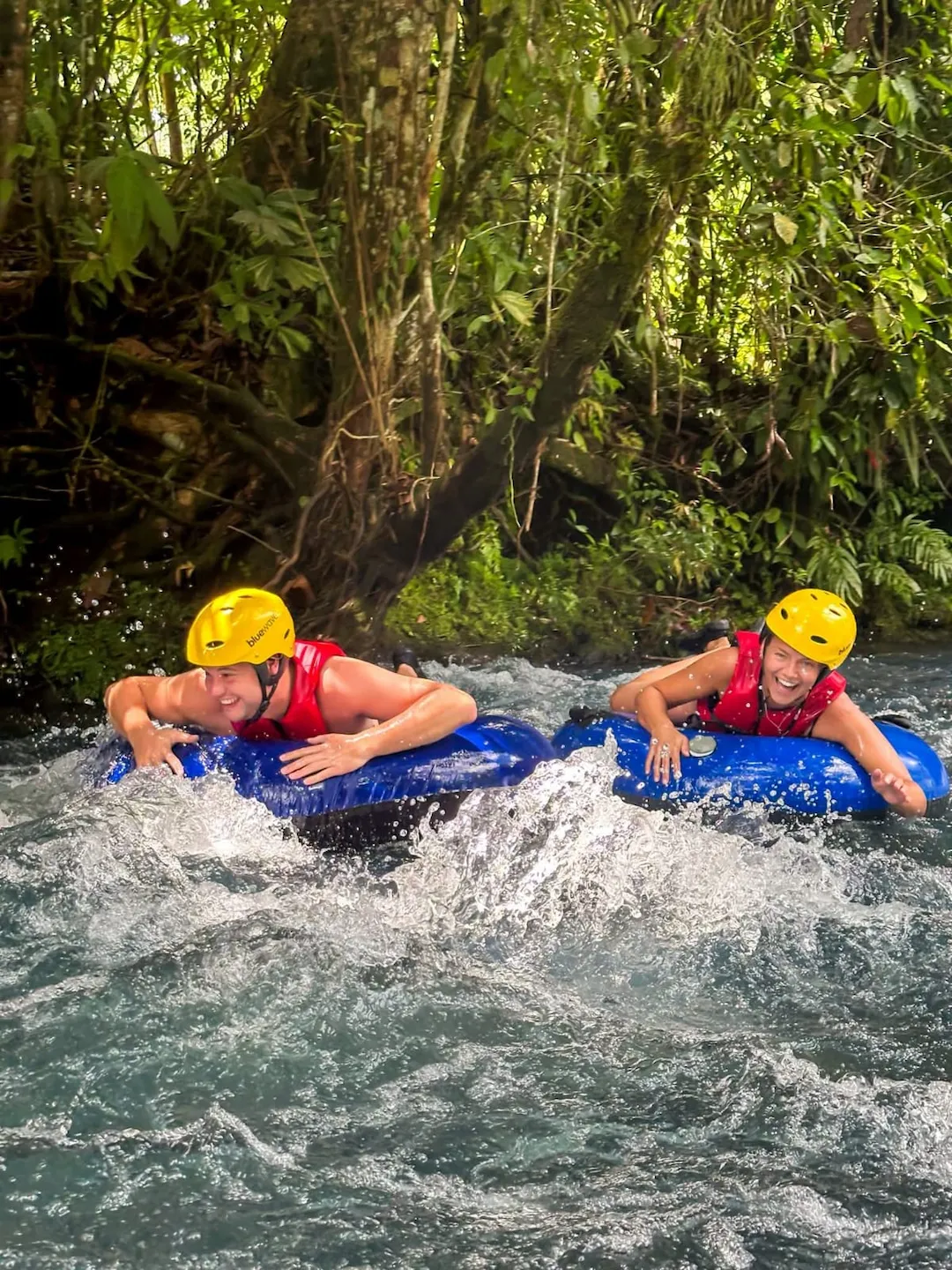 Group tubing together on Río Celeste, seeing the blue color up close